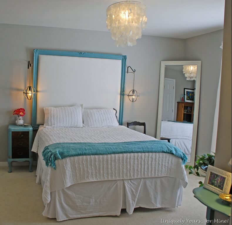 Oversized Headboard with Turquoise Accents and Chandelier