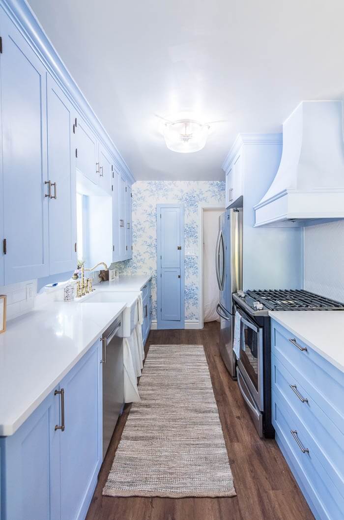Floor to Ceiling Light Blue Painted Cabinets with Blue and White Toile