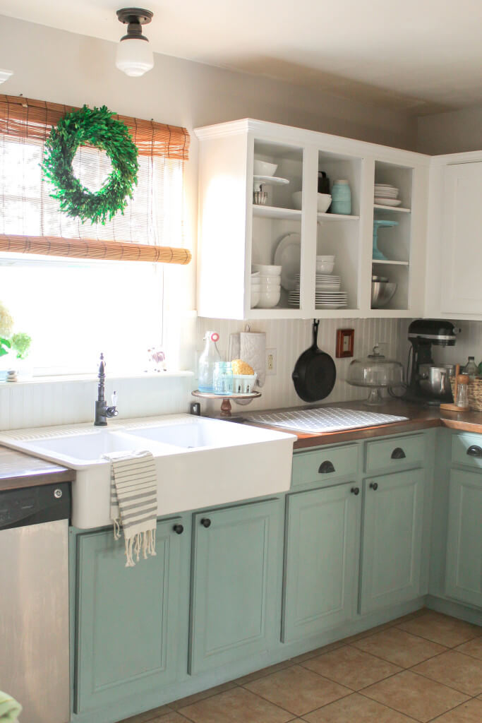 Contrasting Lower Light Blue and Green Cabinets with Traditional Knobs