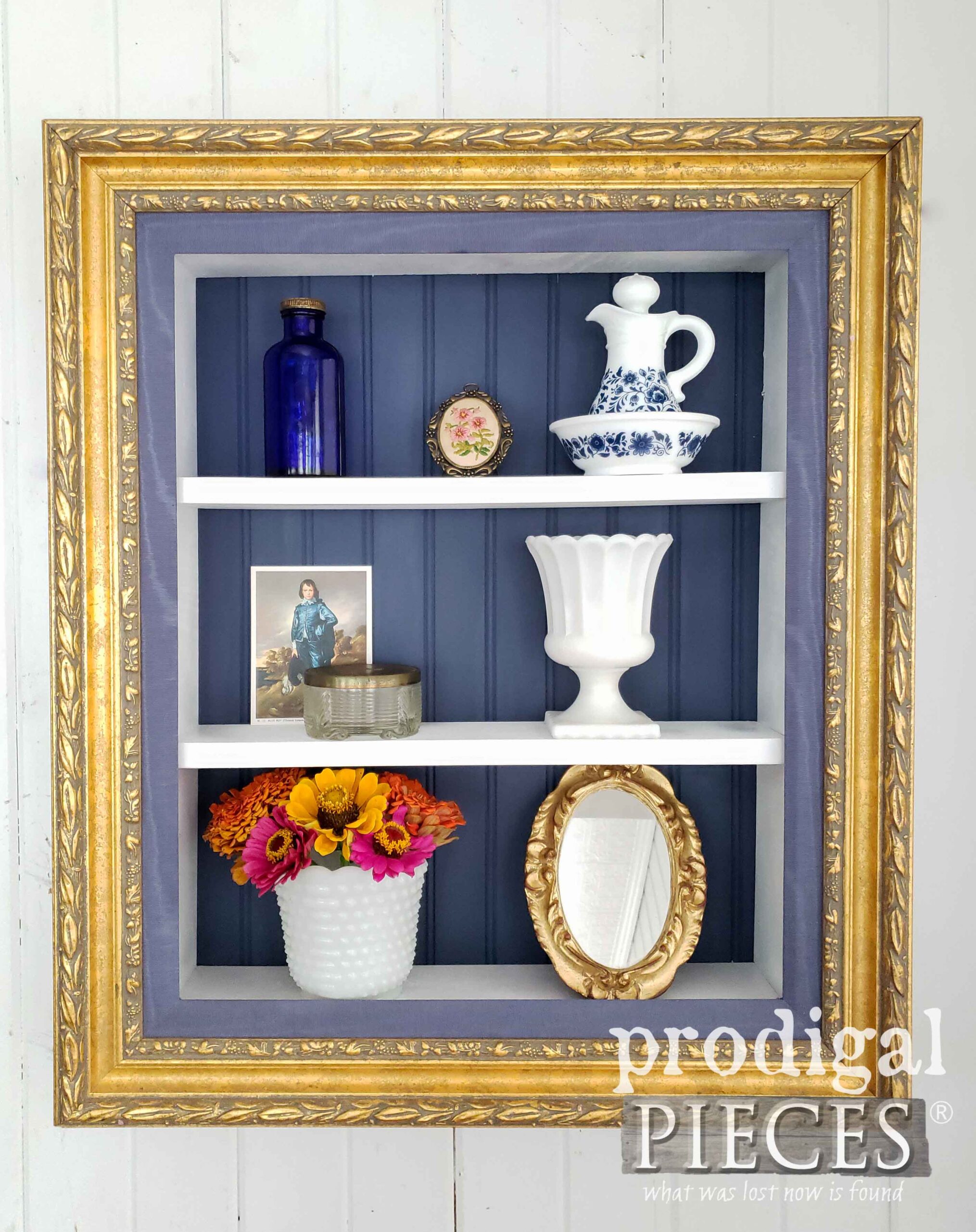 Elegant Gold Frame Shelf for Personal Mementos