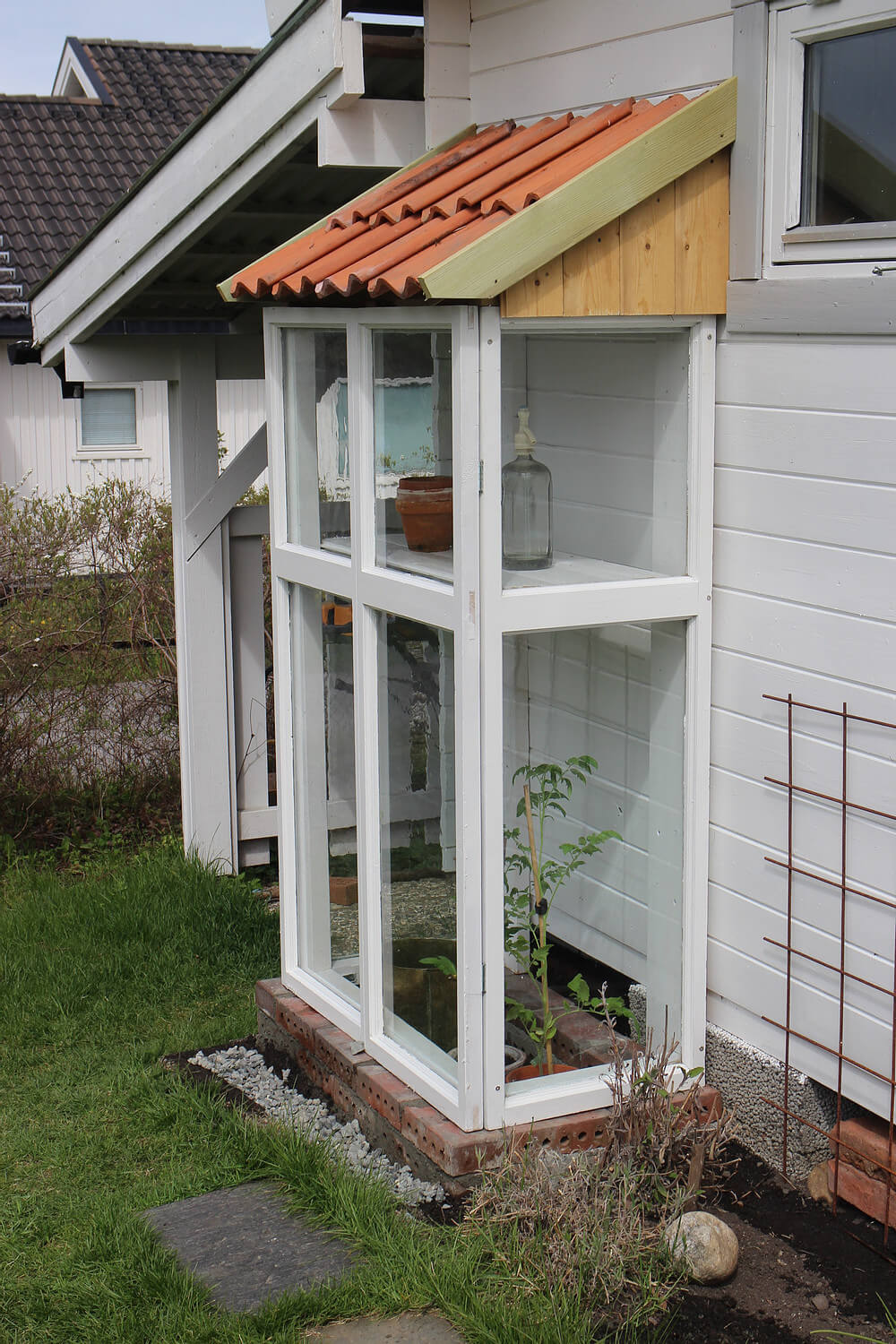 Long and Lean Glass Greenhouse Home Addition