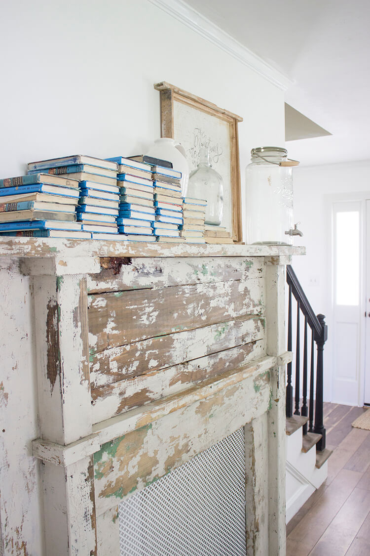 Books and Glass on an Old Farmhouse Fireplace