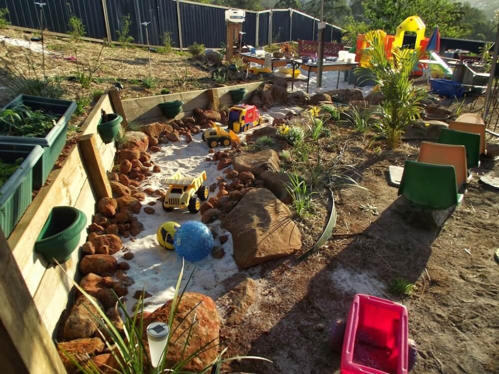 Natural Sandbox Perimeter with Stones and Rocks