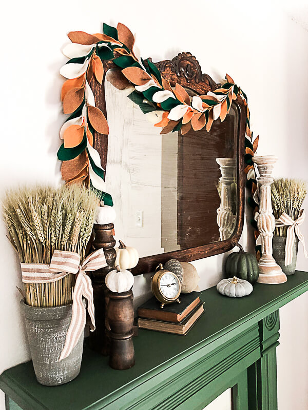 Antique Mirror Surrounded by Wheat and Pumpkins