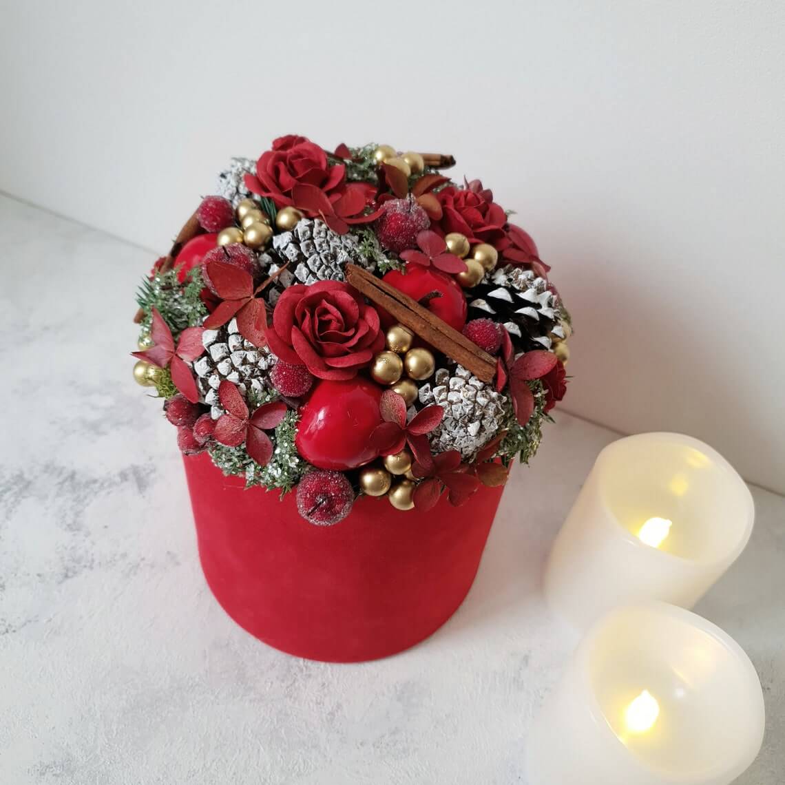 Christmas Centerpiece with Cinnamon and Red Flowers