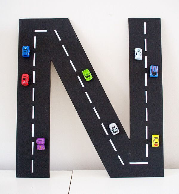 Budget-Friendly Cardboard Road Initial with Toy Cars
