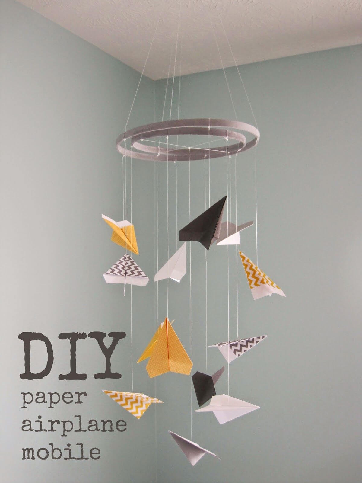 Adorable Neutral Colored Paper Airplane Mobile