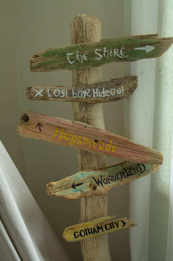 Wooden Signpost Leading to Adventure
