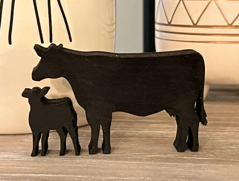 Pair of Wooden Cow Silhouette Figurines