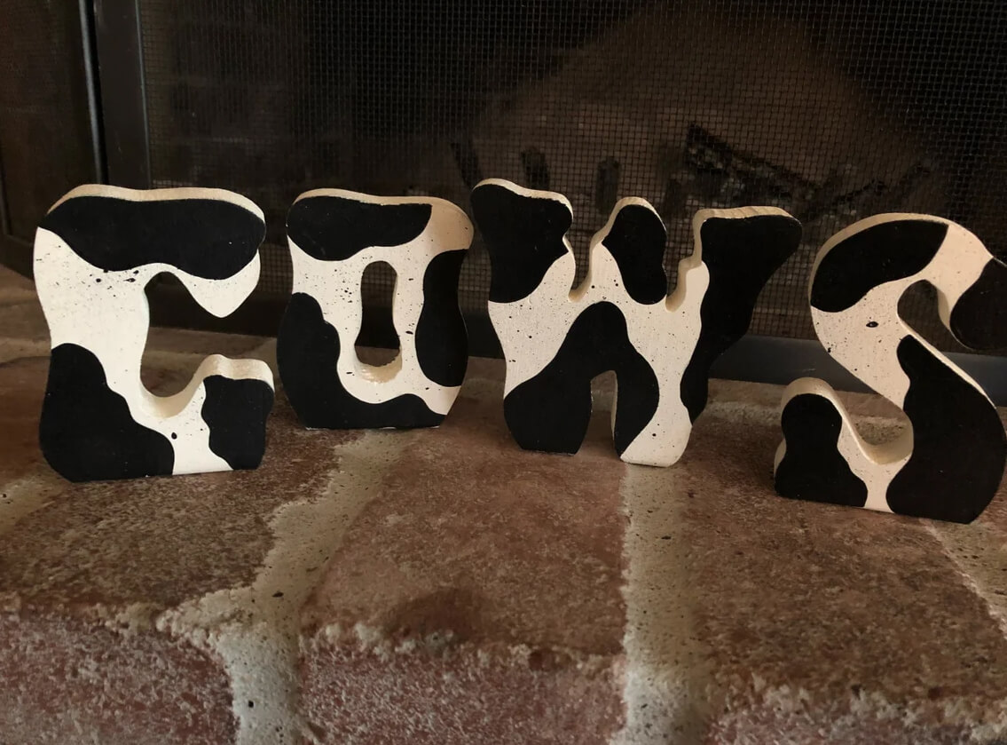 Black and White Wooden Cow Letters